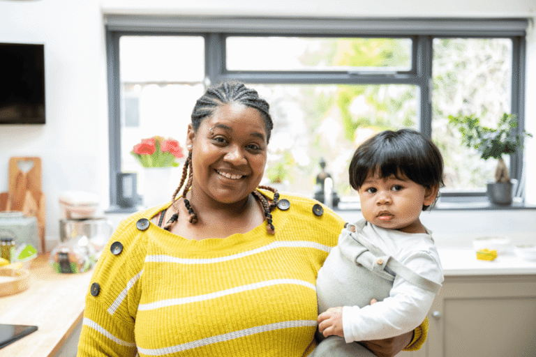Foster mother in kitchen with you boy